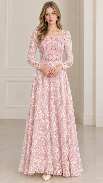 Front full-length view of model in blush pink floral embroidered lace maxi dress