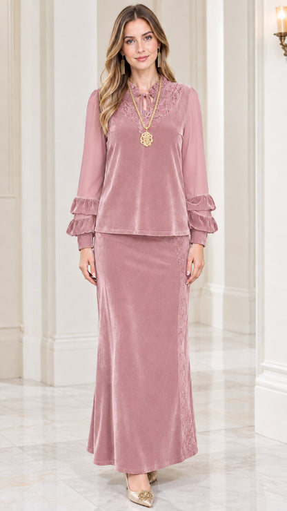 Front view of model wearing dusty pink velvet two-piece maxi skirt set