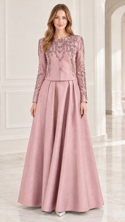 Dusty rose pink long-sleeve beaded evening gown with pleated skirt on model