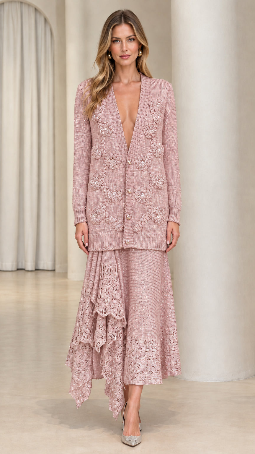 Model wearing dusty pink floral knit cardigan and asymmetrical ruffle midi skirt set