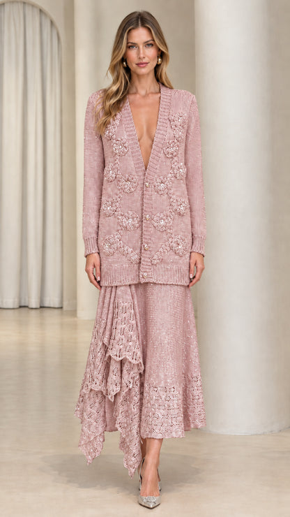 Model wearing dusty pink floral knit cardigan and asymmetrical ruffle midi skirt set