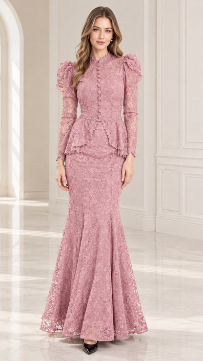 Model wearing dusty rose pink lace peplum mermaid evening gown