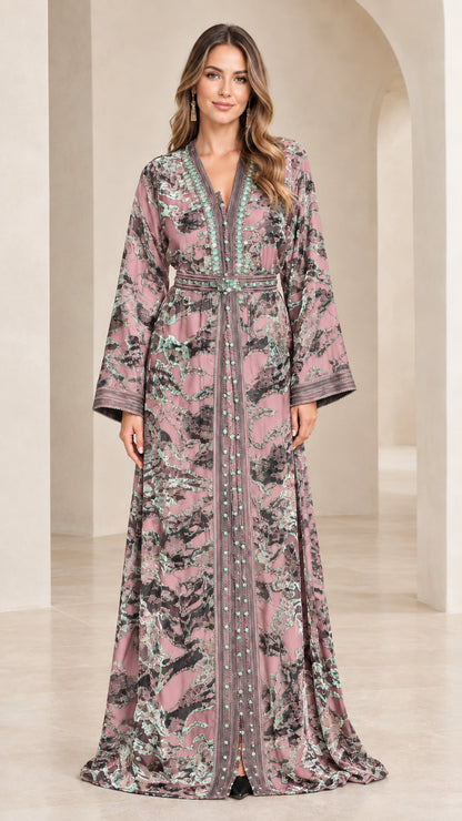 Full-length view of woman wearing dusty rose floral velvet kaftan maxi dress