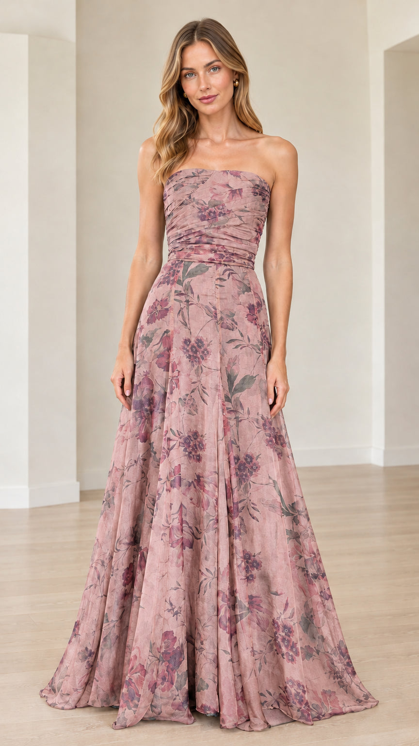 Front view of model wearing dusty rose floral strapless maxi gown