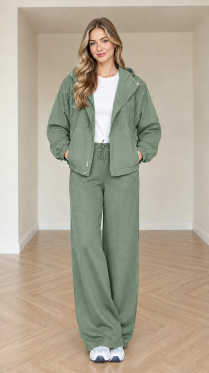 Model wearing sage green women's zip-front hooded jacket and pant set