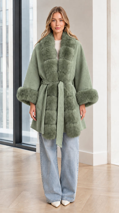 Model wearing Sage Green faux fur trim belted cape coat