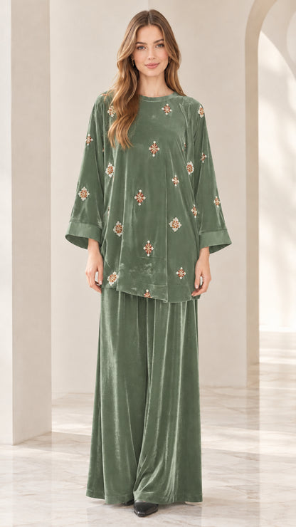 Front view of model wearing sage green embroidered velvet two piece set