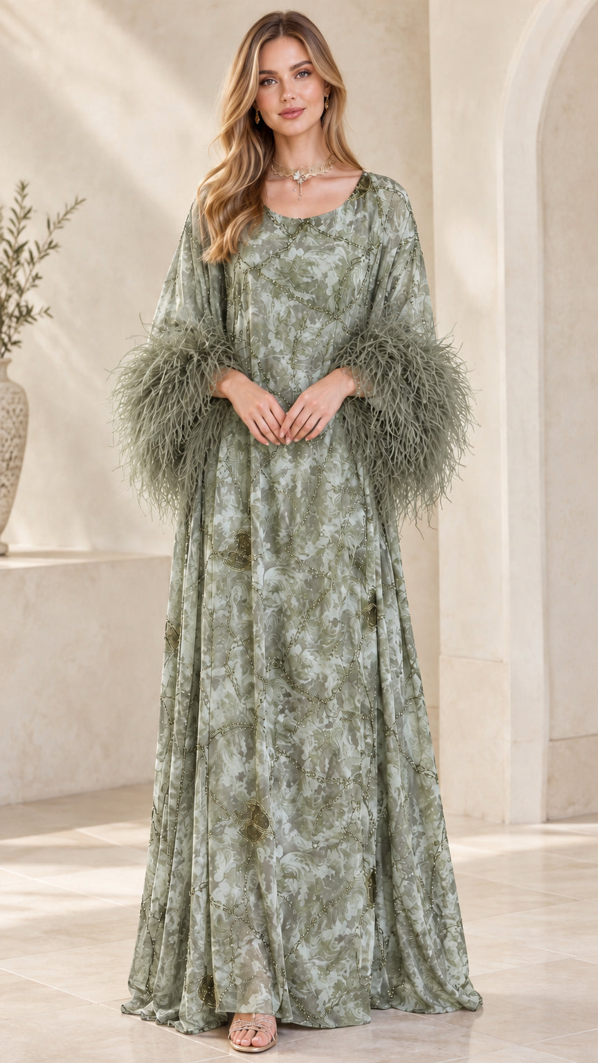 Model wearing sage green printed kaftan dress with matching green feather cuffs