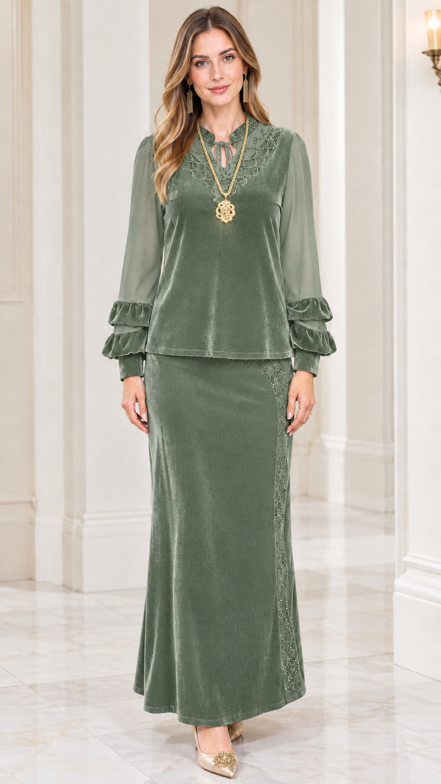 Front view of model wearing sage green velvet two-piece maxi skirt set