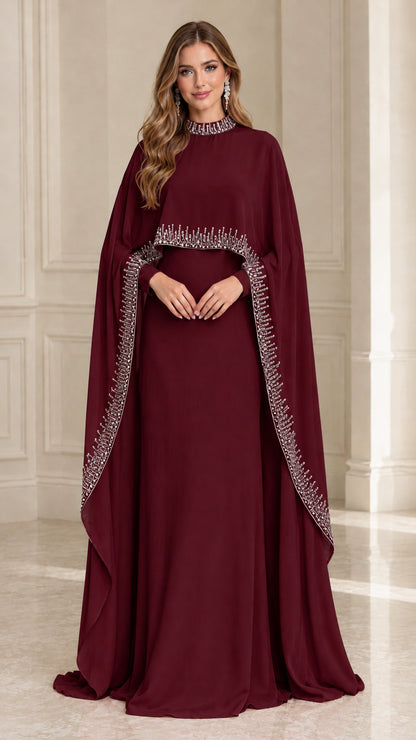 Front view of Burgundy high neck embellished cape overlay formal gown