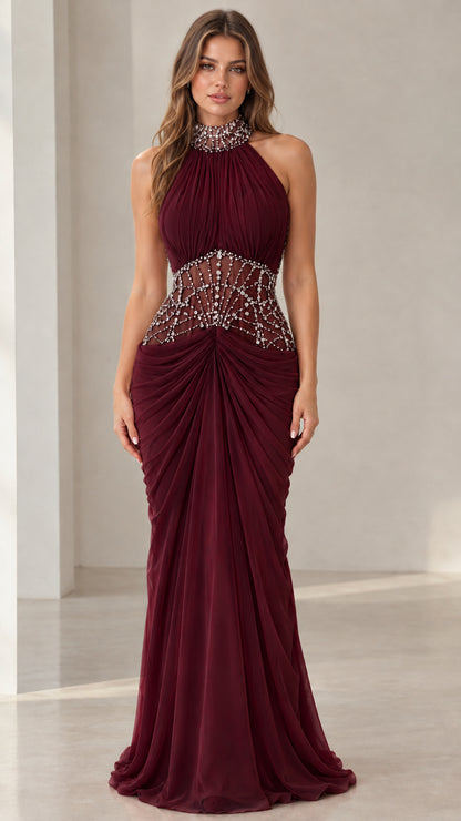 Front view of burgundy wine halter neck beaded illusion evening gown