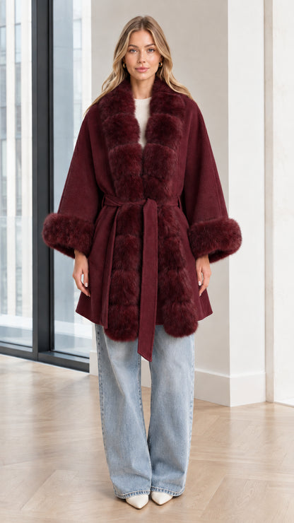 Model wearing Burgundy faux fur trim belted cape coat