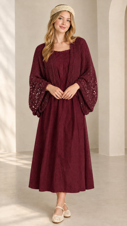 Front view of burgundy wine sequin open-knit shrug cardigan over burgundy dress