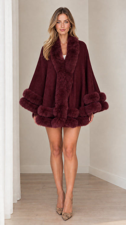 Model wearing burgundy wine faux fur trim cape coat with open front