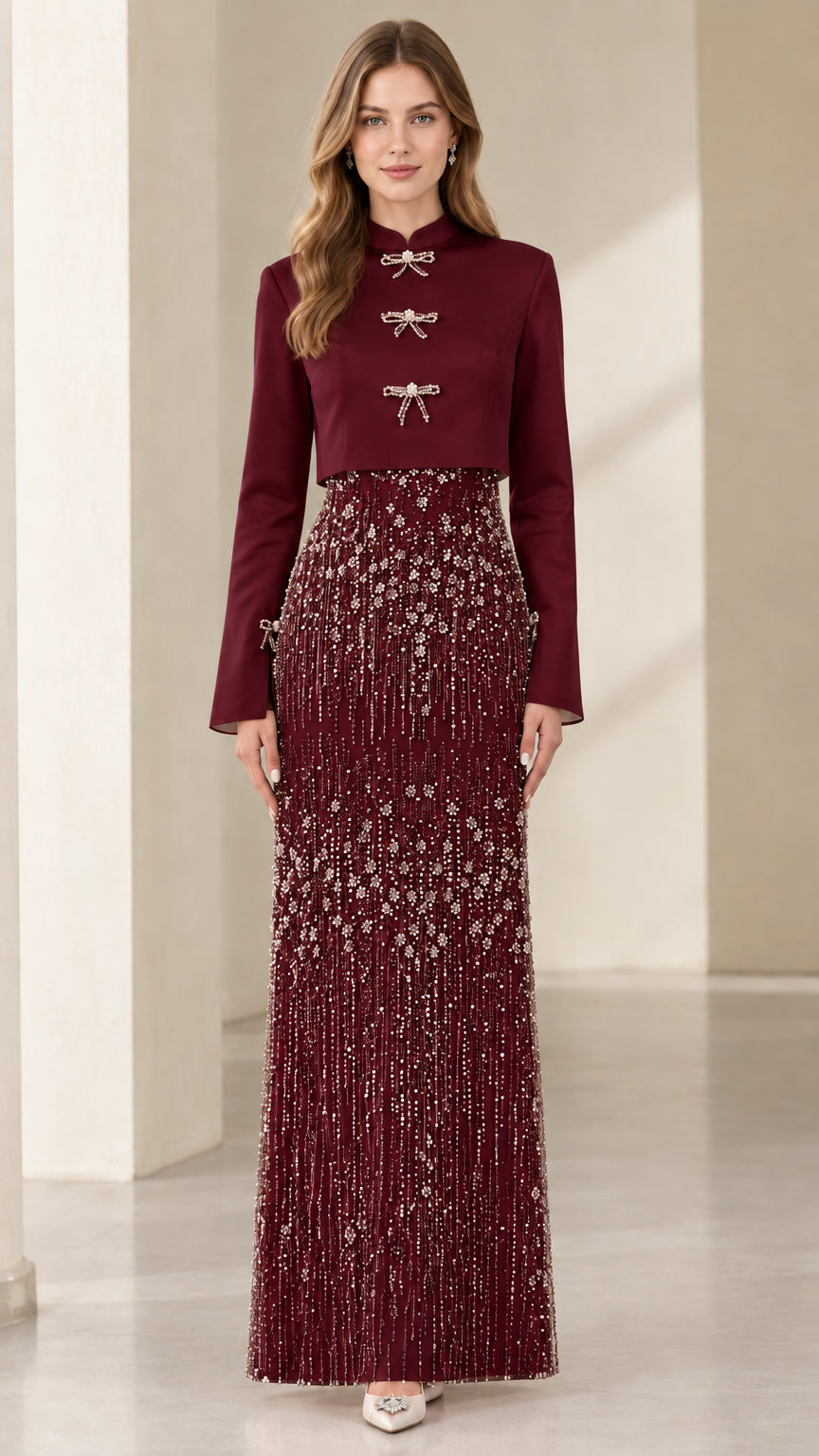 Model wearing Burgundy red Mandarin collar jacket with embellished formal maxi skirt