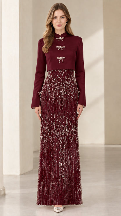 Model wearing Burgundy red Mandarin collar jacket with embellished formal maxi skirt