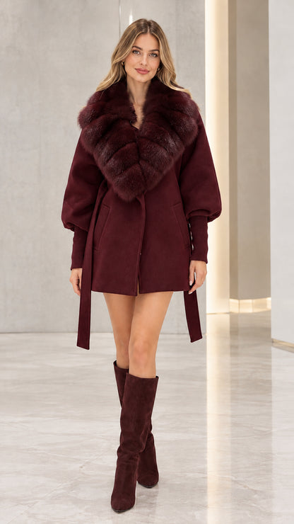 Front view of model wearing the deep burgundy wine belted faux fur coat