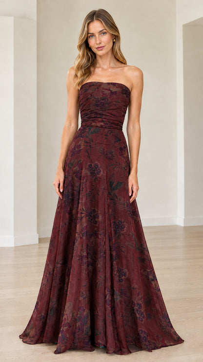 Front view of model wearing burgundy wine floral strapless maxi gown