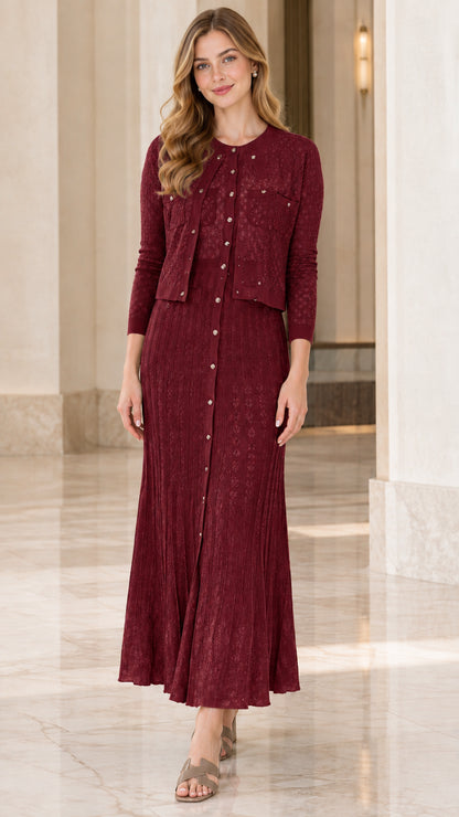 Model wearing burgundy two-piece textured knit cardigan and maxi dress set