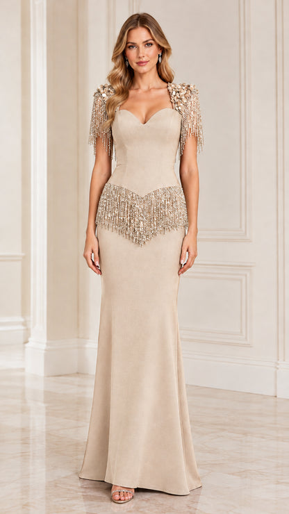 Model wearing champagne beige floor-length evening dress with shimmering fringe