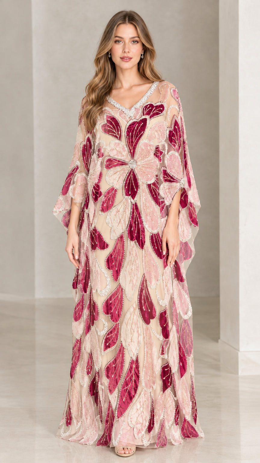 Front view of model wearing blush nude floral beaded kaftan maxi dress