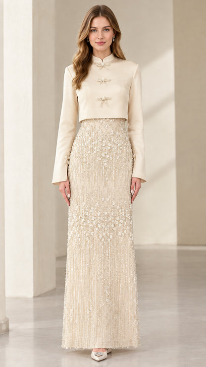 Model wearing Champagne cream cropped jacket and beaded column evening dress