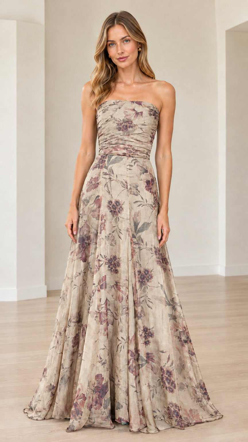 Front view of model wearing champagne beige floral strapless maxi gown