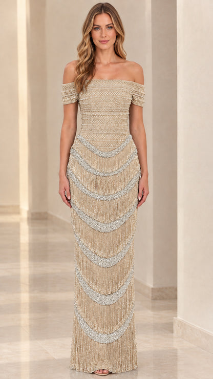 Front view of champagne gold off-the-shoulder evening gown with beaded fringe detail