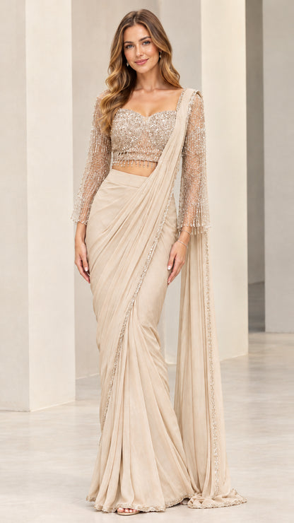 Champagne beige pre-draped saree set with beaded sleeves and fluid drape