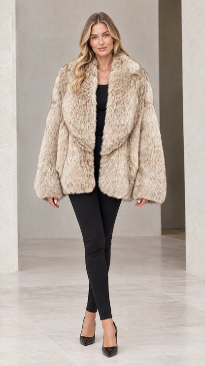 Front view of woman wearing champagne beige faux fur coat