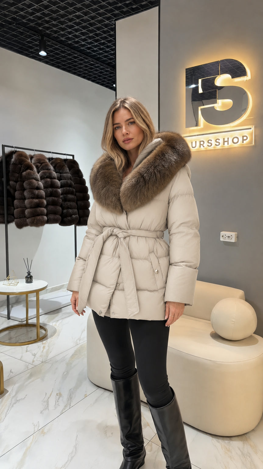 Model wearing cream off-white belted winter jacket with faux fur collar