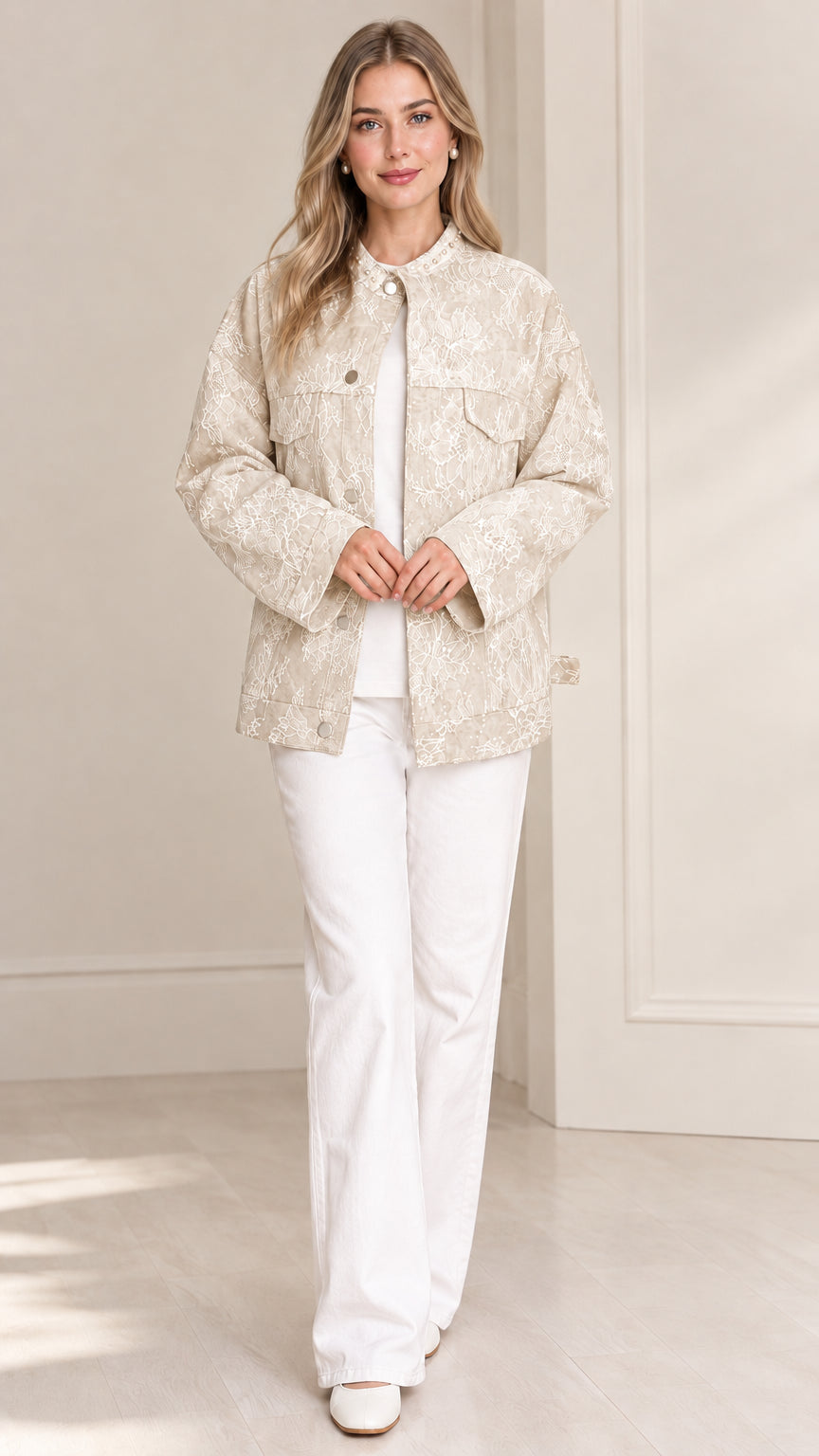 Model wearing champagne beige floral lace textured jacket with pearl collar