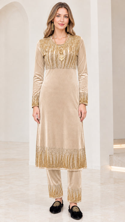 Full front view of women's champagne beige velvet tunic and pant set with gold accents
